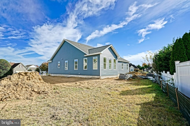 view of home's exterior with a yard