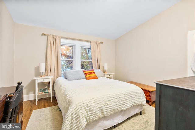 bedroom featuring dark wood-type flooring