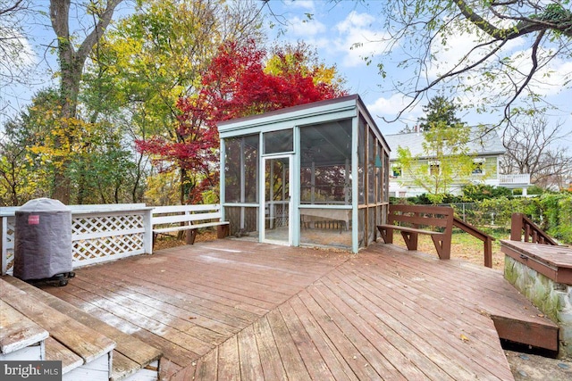 wooden terrace with a sunroom