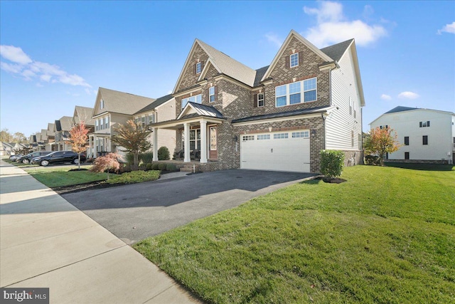 view of front of house featuring a front yard and a garage