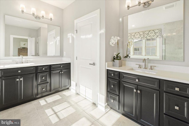 bathroom with tile patterned flooring and vanity