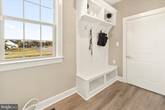 mudroom with light hardwood / wood-style floors