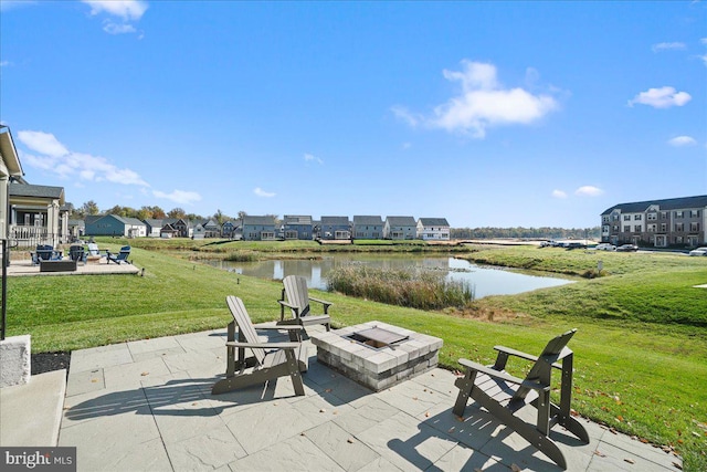 view of patio / terrace featuring a water view and an outdoor fire pit