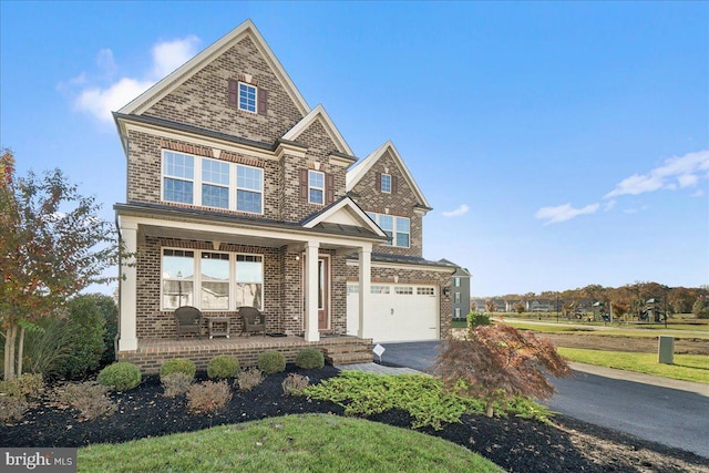 craftsman-style home with a porch and a garage