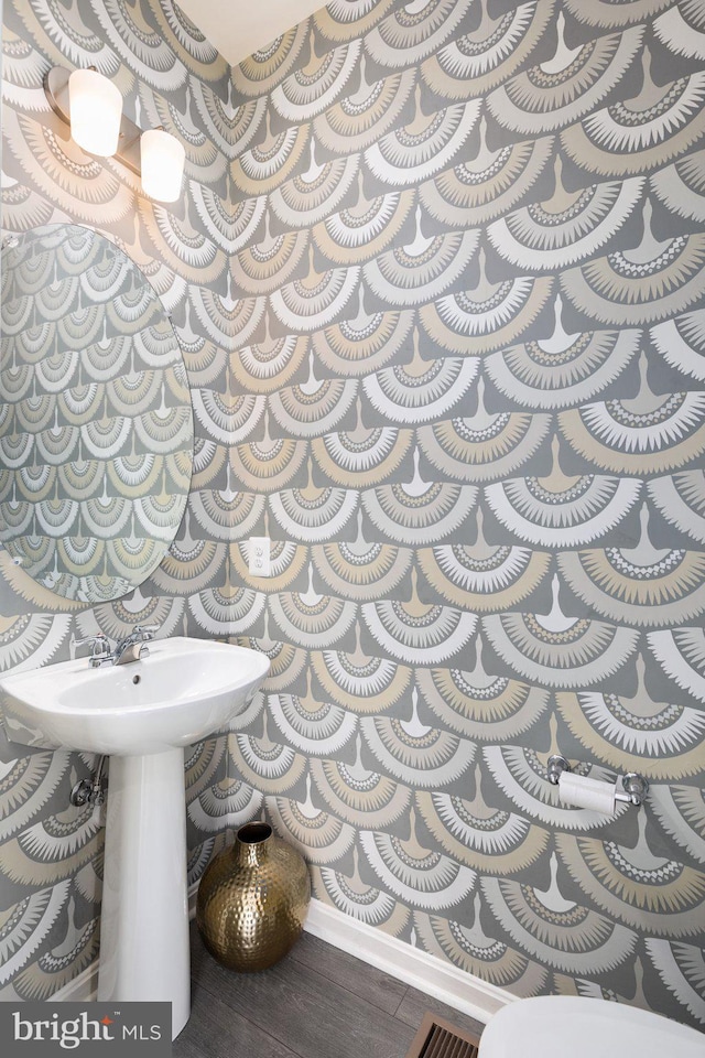 bathroom with hardwood / wood-style flooring