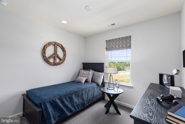 bedroom with carpet flooring and baseboards