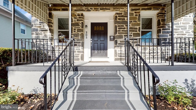 doorway to property with a porch