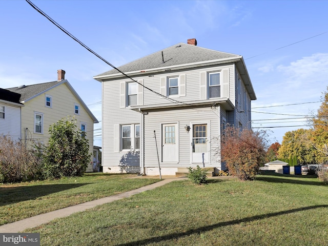 view of property with a front lawn