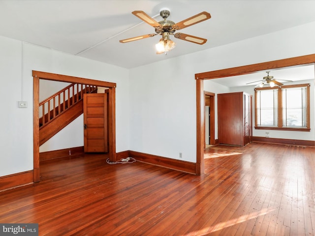 spare room with ceiling fan and dark hardwood / wood-style flooring