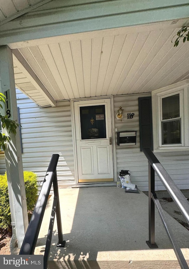 doorway to property featuring a porch