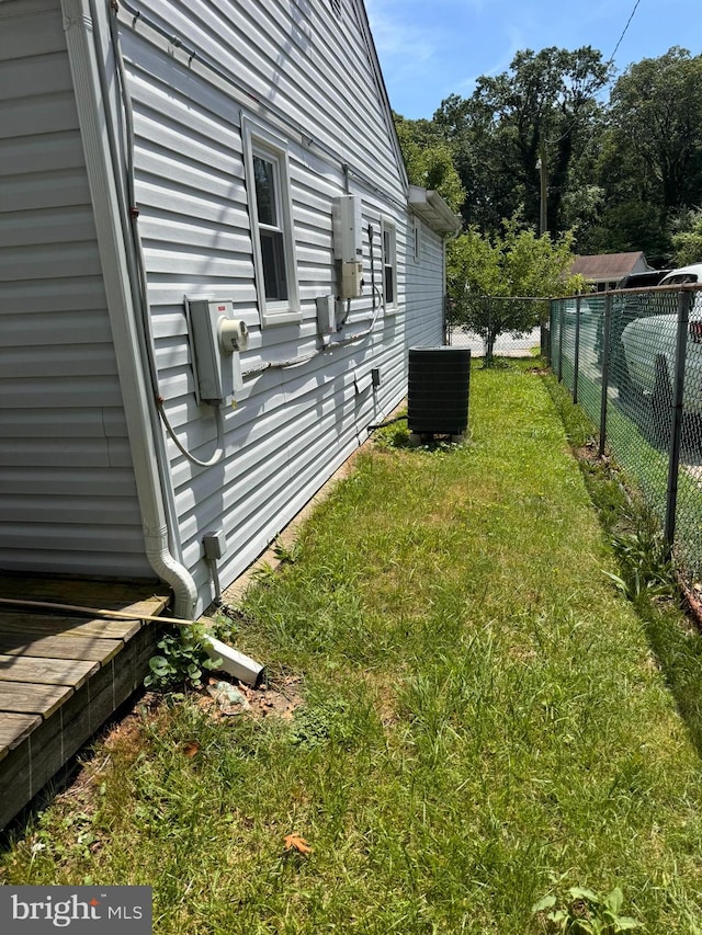 view of yard featuring central AC unit