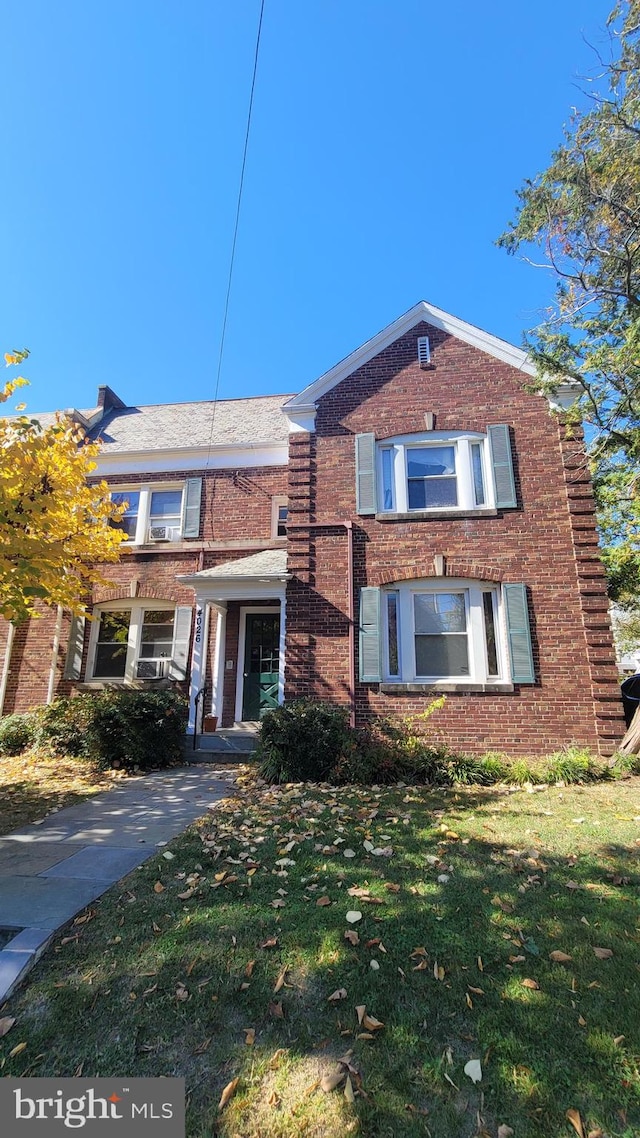 view of property featuring a front yard