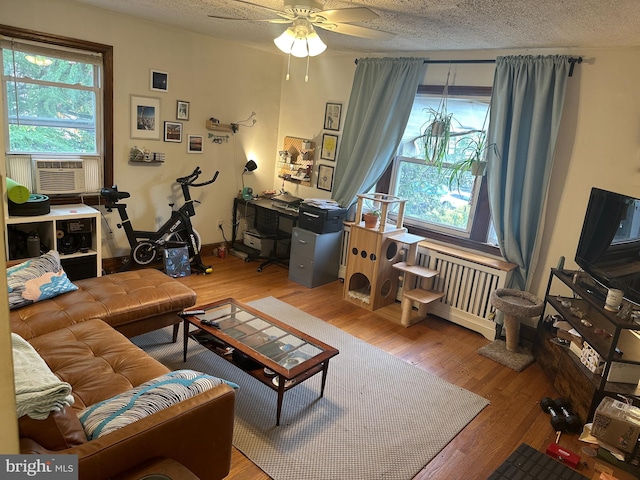 4026 9th St NE, Washington, DC 20017 - living room with cooling unit, ceiling fan, a wealth of natural light, and wood finished floors