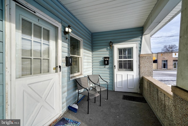 doorway to property with covered porch