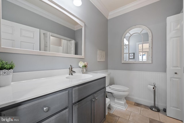 bathroom featuring vanity, ornamental molding, and toilet