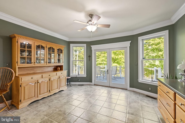 interior space with crown molding, french doors, plenty of natural light, and ceiling fan