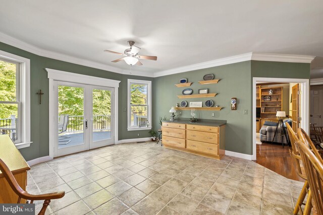 doorway featuring french doors, crown molding, and ceiling fan