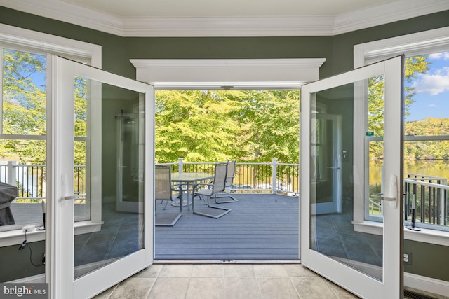 doorway with crown molding, french doors, and light tile patterned floors