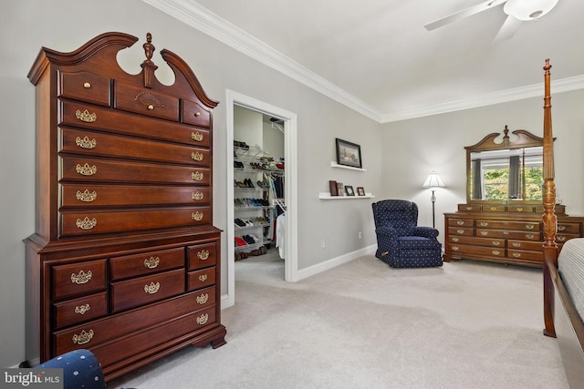 sitting room featuring ornamental molding, light carpet, and ceiling fan