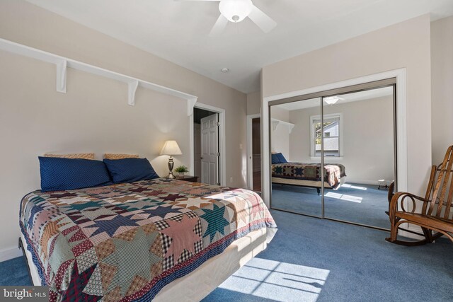 bedroom with carpet, a closet, and ceiling fan