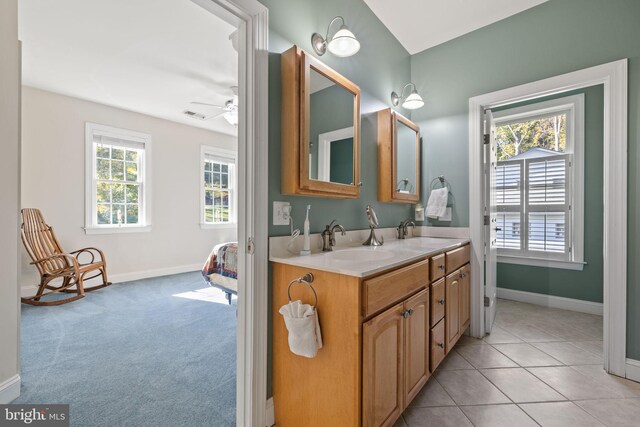 bathroom featuring vanity, ceiling fan, and tile patterned floors