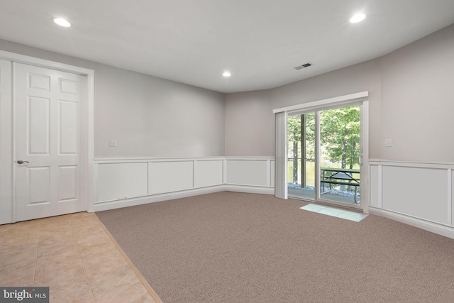 empty room featuring light colored carpet