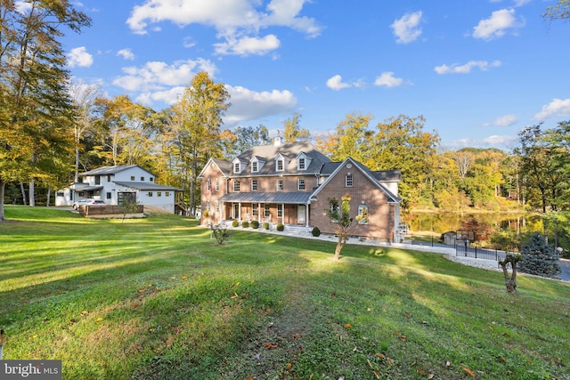 back of property featuring a yard