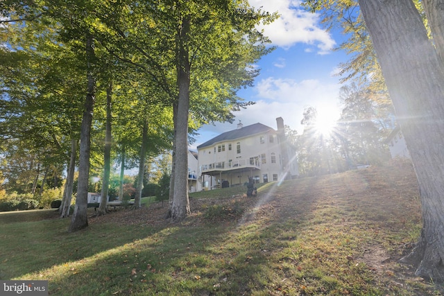 rear view of house with a lawn