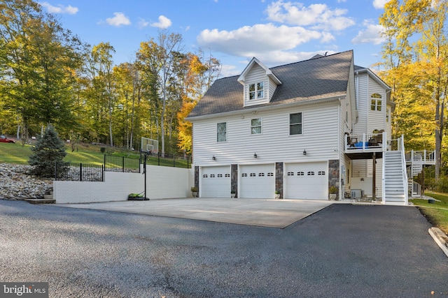 view of side of property featuring a garage