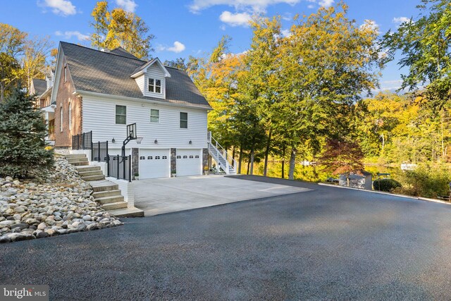 view of side of home with a garage