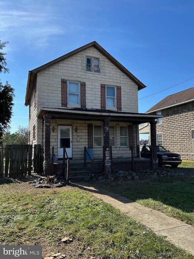 view of front property featuring covered porch