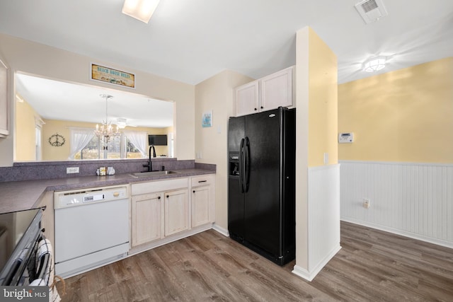 kitchen with sink, white dishwasher, black refrigerator with ice dispenser, and wood-type flooring