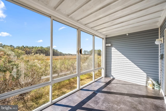 unfurnished sunroom featuring a healthy amount of sunlight