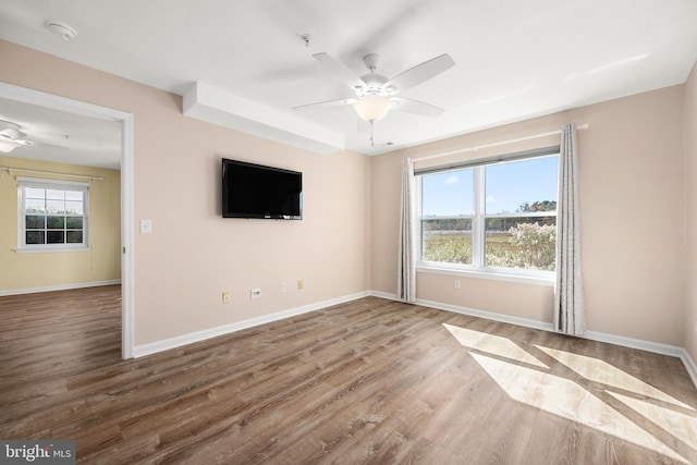 empty room featuring hardwood / wood-style floors and ceiling fan