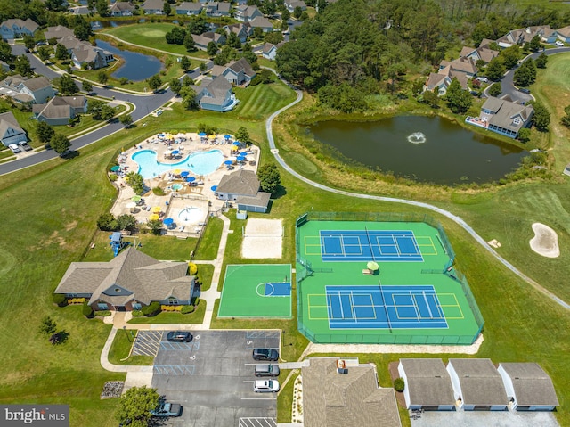 birds eye view of property with a water view