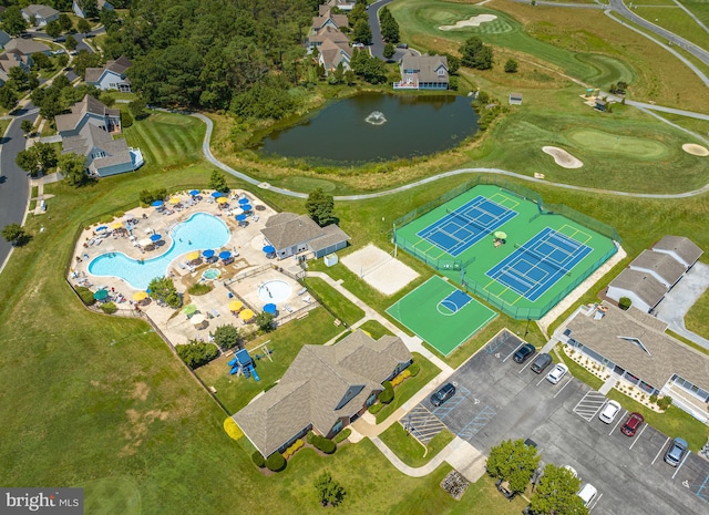 birds eye view of property with a water view