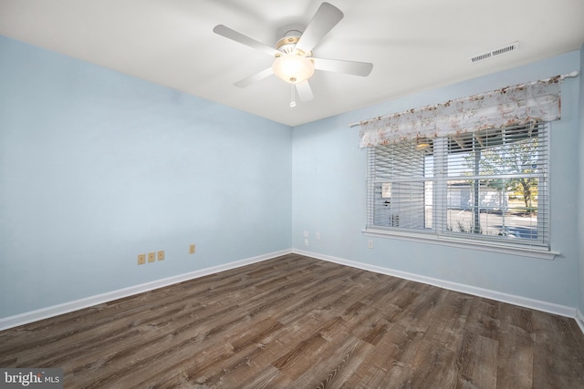 unfurnished room featuring ceiling fan and dark hardwood / wood-style floors