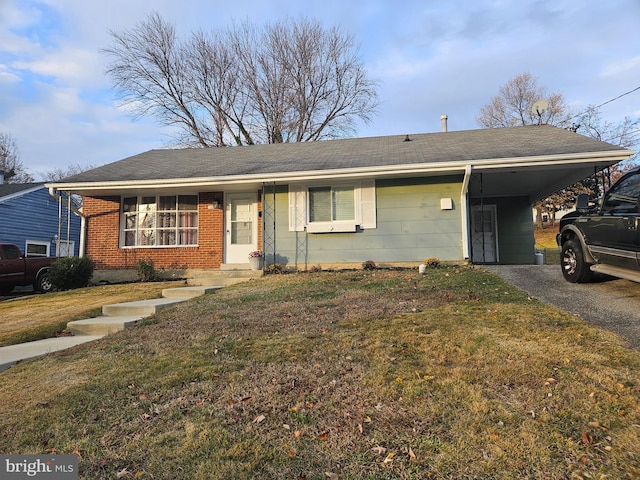 single story home with a carport and a front lawn