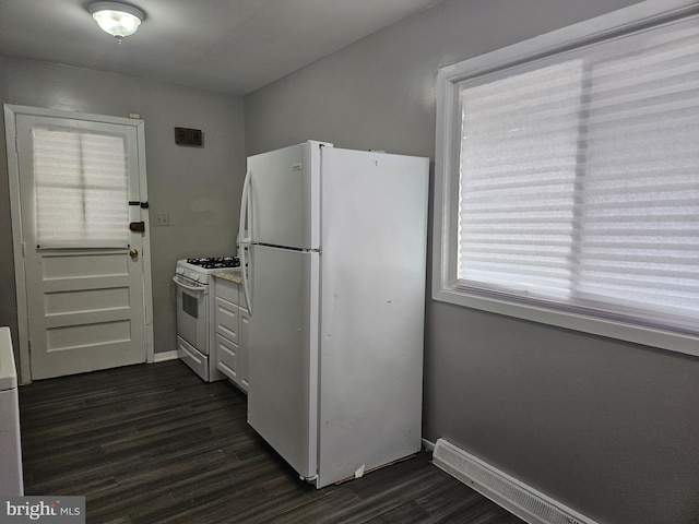 kitchen featuring white cabinetry, a baseboard radiator, dark hardwood / wood-style floors, and white appliances