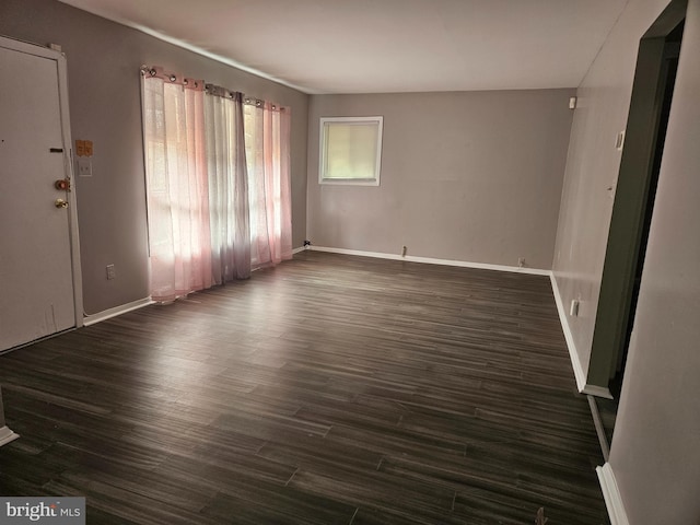 spare room featuring dark hardwood / wood-style floors