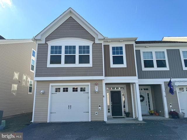 multi unit property featuring a garage