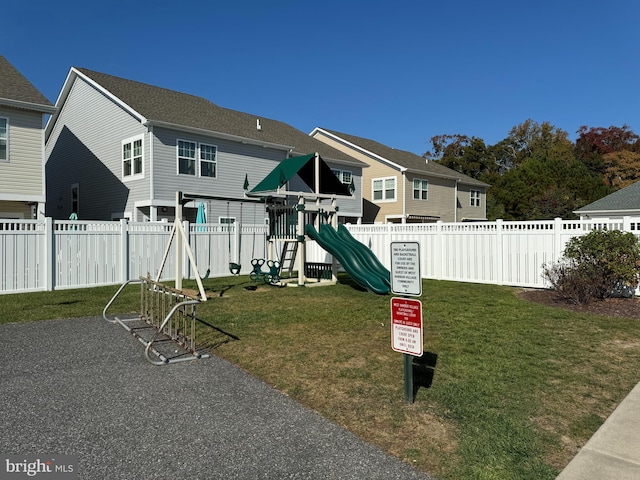 view of playground with a yard