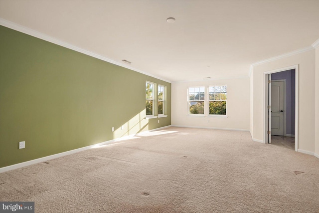 carpeted spare room with ornamental molding