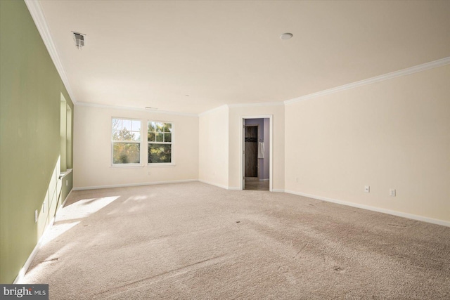 carpeted spare room with crown molding