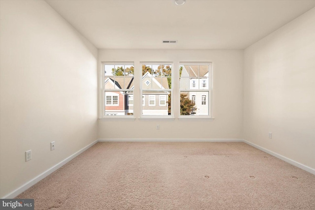 unfurnished room featuring carpet