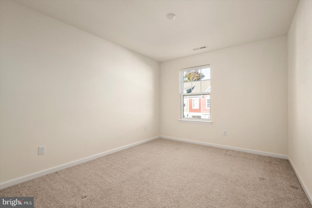 empty room with carpet flooring