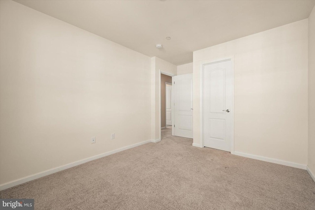 unfurnished bedroom with light carpet