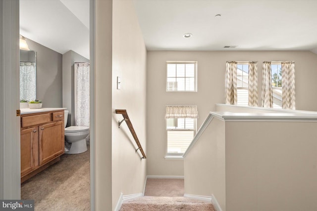 stairs featuring carpet flooring