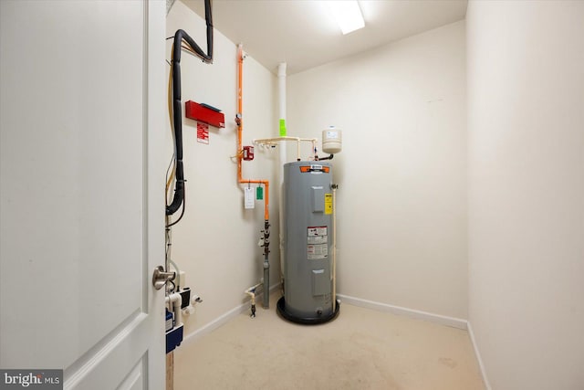 utility room featuring water heater