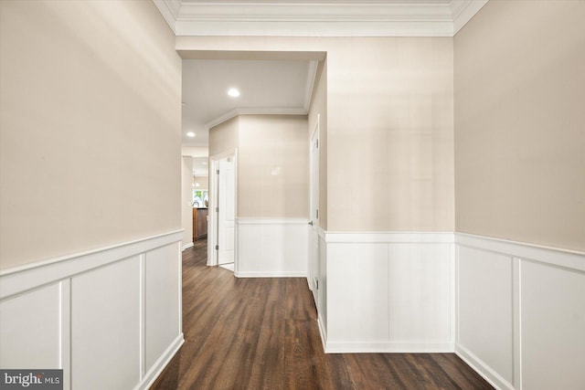 hall with ornamental molding and dark wood-type flooring